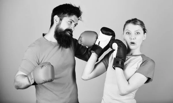 Family violence. Man and woman in boxing gloves. Boxing sport concept. Couple girl and hipster practicing boxing. Sport for everyone. Amateur boxing club. Equal possibilities. Strength and power