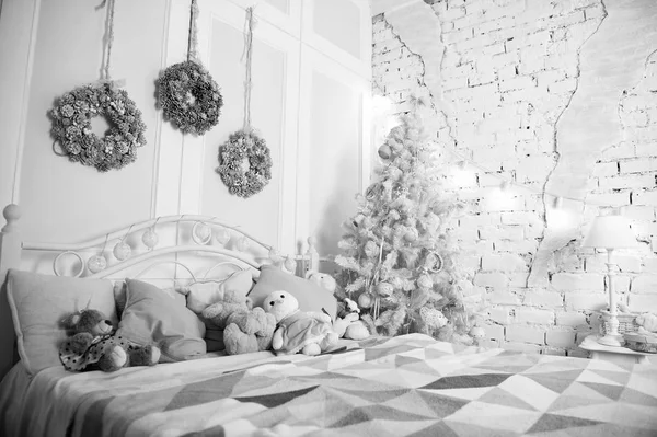 Merry Christmas and Happy Holidays. Christmas composition. Happy new year. Christmas. Beautiful decorated room with tree and toys. The morning before Xmas. New year holiday. Christmas interior