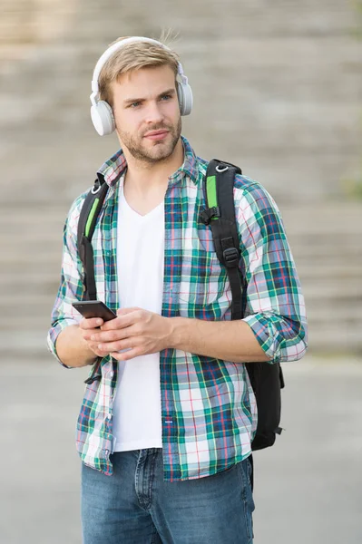 College life. College student headphones smartphone. Online course. Audio book concept. Educational technology use physical hardware software and educational theoretic. College education concept