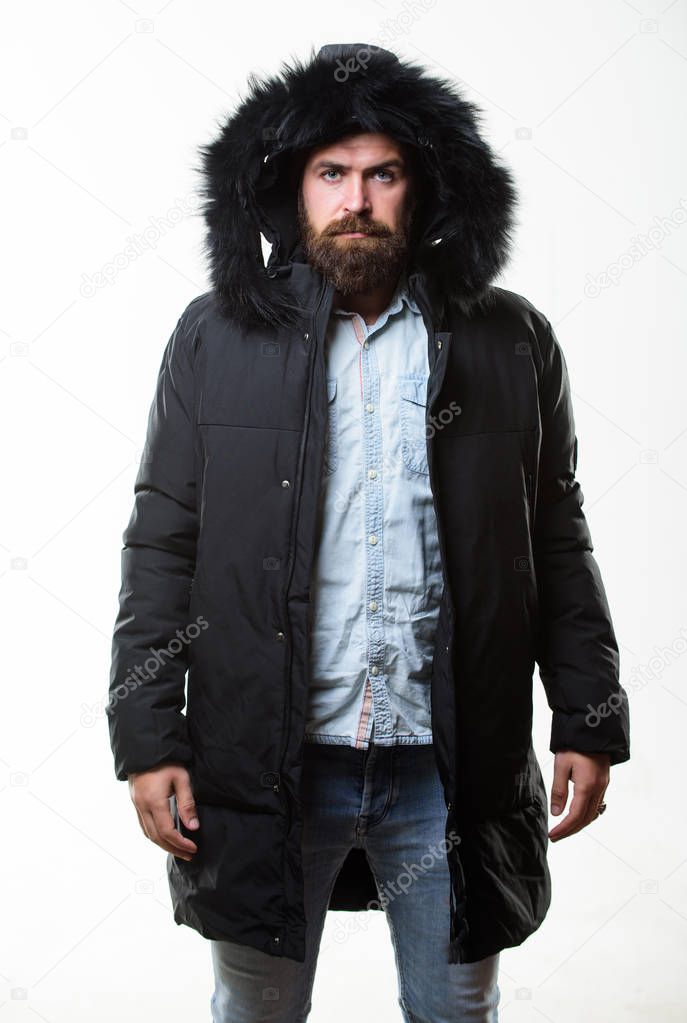 Hipster winter fashion. Guy wear black winter jacket with hood. Prepared for weather changes. Winter stylish menswear. Man bearded stand warm jacket parka isolated on white background. Winter outfit