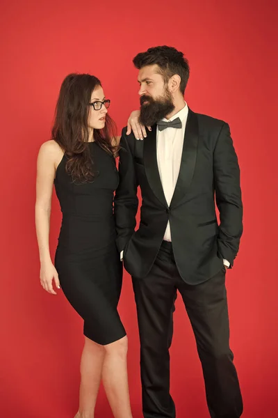 Formal dress code. Visiting event or ceremony. Couple ready for award ceremony. Main rules picking clothes. Corporate party. Award ceremony concept. Bearded gentleman wear tuxedo girl elegant dress