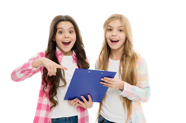 This stylish clip board keeps our documents handy. Happy little girls holding writing board. Small children smiling with blue plastic board. Clip board is a good solution for document management — Stock Photo, Image