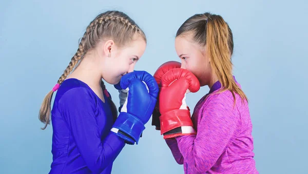 Female friendship. Girls in boxing sport. Boxer children in boxing gloves. Girls cute boxers on blue background. Friendship as battle and competition. Pass boxing challenge. Test for fortitude — Stock Photo, Image