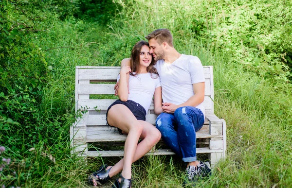 Family weekend. Lovers cuddling. Couple in love sit on bench. Summer vacation. Romantic date in park. Boyfriend girlfriend in love. Trust and intimacy. Youth hang out. Love and romance concept — Stock Photo, Image
