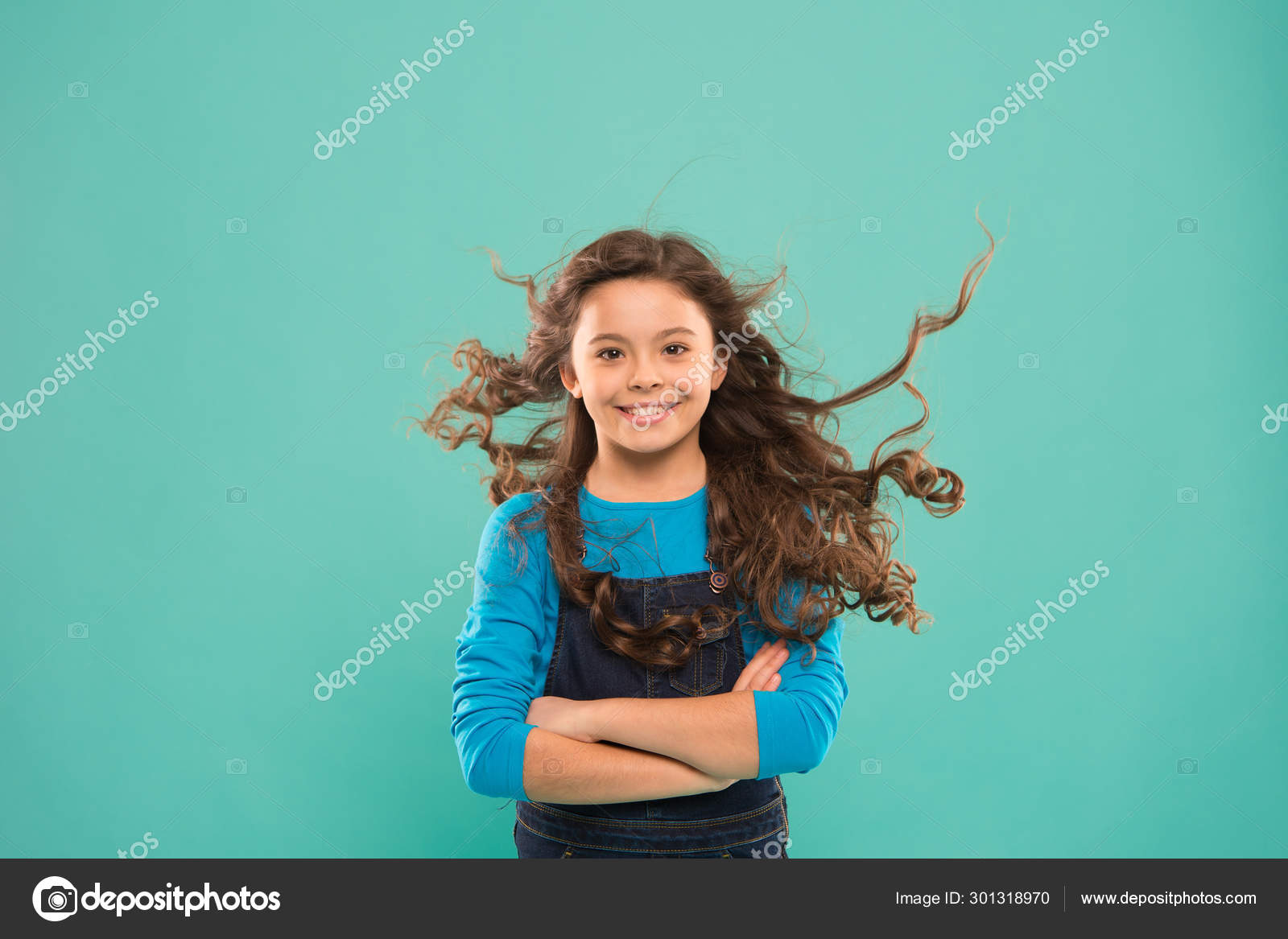 Just Amazing Happy Child With Long Curly Hair On Blue Background