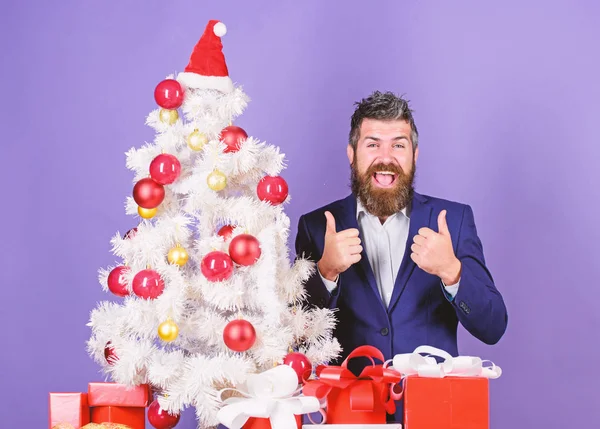 How to organize awesome office christmas party. Man bearded hipster wear formal suit near christmas tree. Checklist christmas preparation. Christmas gifts and decorations. Preparation and celebration