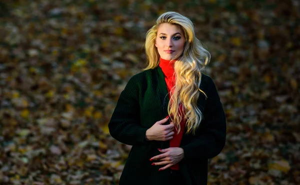 Autumn hair care important to avoid dry frizzy hairstyle. Girl gorgeous blonde autumn park. Long hair care concept. How to take care of your hair in autumn. How repair bleached hair fast and safely
