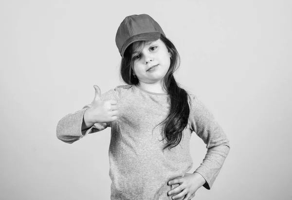 Thumbs up if you feel beautiful. Adorable girl showing approval hand gesture. Cute small child gesturing approval sign. Little kid expressing approval for clothing and accessory. Seal of approval — Stock Photo, Image