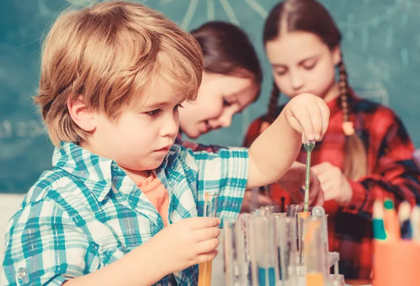 Laboratory Research - Scientific project For Chemical test. Science and education. chemistry lab. happy children. back to school. School chemistry laboratory. Working together to prepare for finals