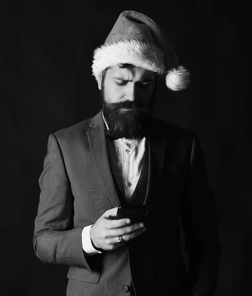 Manager with beard types message on cell phone. — Stock Photo, Image