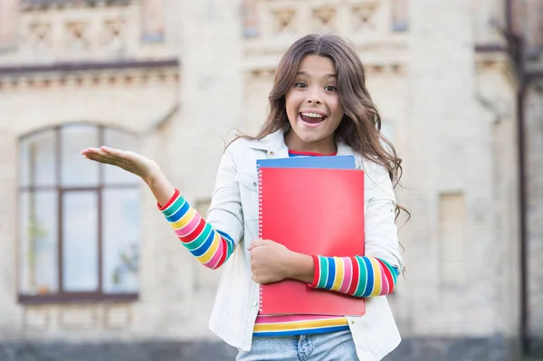 Successful pupil. Taking extra course for deeper learning. School education. Modern education. Kid smiling girl school student hold workbooks textbooks for studying. Education for gifted children — Stock Photo, Image