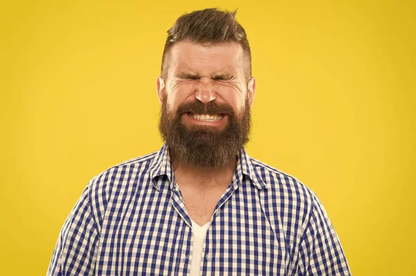 Just sneezed. Man bearded hipster with sneezing face closed eyes close up yellow background. Brutal hipster sneezing. Allergy season concept. Take allergy medications. Can not stop sneezing — Stock Photo, Image