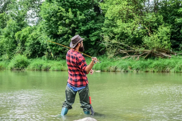 Fisherman catching fish. Teach man to fish. Fishing outdoor sport. Fishing hobby. Calm and tranquil. Patience and waiting. Fly fishing may well be considered most beautiful of all rural sports — Stock Photo, Image