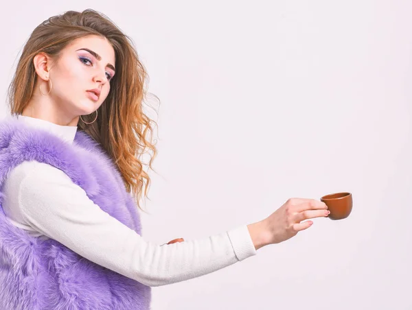 Elite coffee concept. Elite coffee variety concept. Lady drink espresso little ceramic cup white background. Elite drink with caffeine. Enjoy aroma and taste hot coffee. Woman fur coat drink coffee