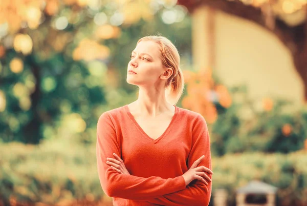 Superior and self confident. Stylish and confident. Confident woman. Sensual blonde girl outdoors sunny day nature background. She is offended but serious. Proud and confident. Woman crossed hands