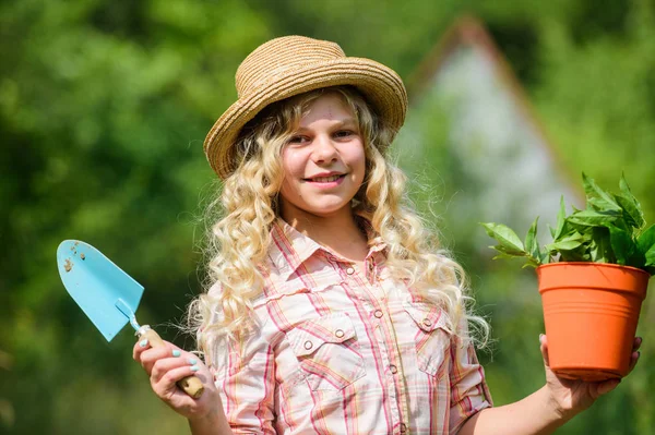 best job. small girl planting with shovel. earth day. environment ecology. green nature protection. small girl farmer care about plant in pot. farming and agriculture. spring season. hellow summer