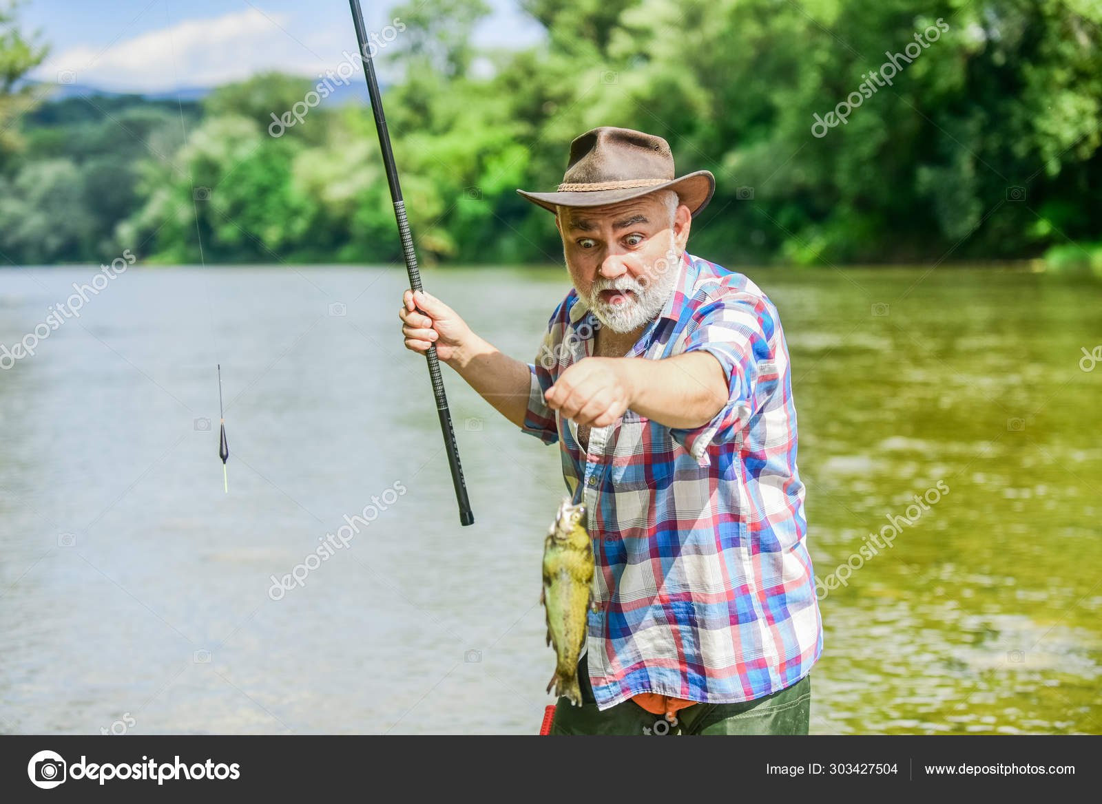 Fisherman with fishing rod. Activity and hobby. Fishing freshwater