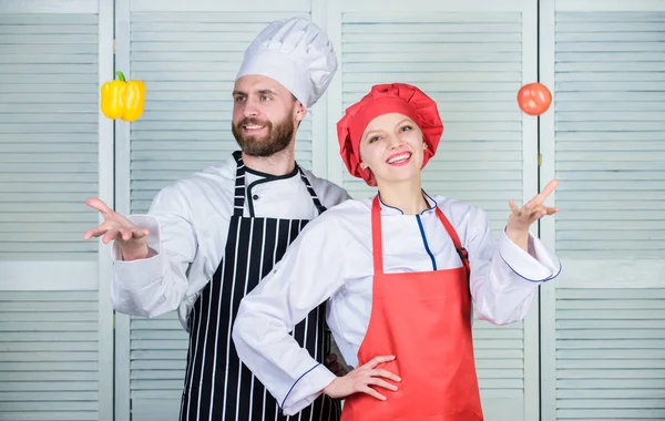 Cooking healthy food. Fresh vegetarian healthy food recipe. Just try. Fresh vegetables. Join healthy lifestyle. Vegetarian family. Man chef hold yellow pepper. Woman and bearded man cooking together — Stockfoto