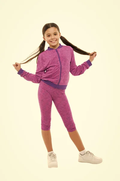 Working out with long hair. Girl cute kid with ponytails wear sport costume isolated on white. Stay comfortable with long hair during sport classes. Deal with long hair while sport exercising — Stock Photo, Image