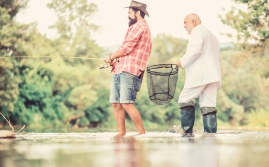 hobi ve rekreasyon. Başarı. büyükbaba ve drandson balıkçılık. emekli işadamı. erkek arkadaşlığı. Fikir para çekiyor. Balıkçı. işadamı Fisher emekliliği kutluyor. yeni emekli hayatı