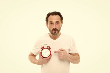 What time is it. Time management and discipline. Punctuality and responsibility. Man with clock on white background. Check time. Man hold alarm clock in hand. Guy bearded mature man worry about time clipart