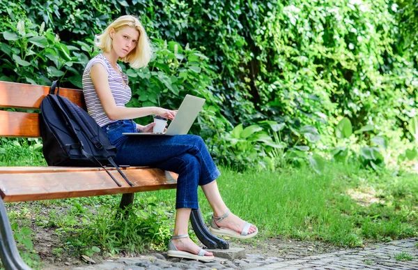 Study outdoors. Woman student work with notebook. Learn study explore. Surfing internet. Modern student life. Regular student. Girl adorable student with laptop and coffee cup sit bench in park