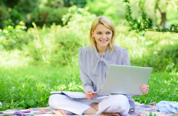 Online freelance career concept. Guide starting freelance career. Pleasant occupation. Business lady freelance work outdoors. Become successful freelancer. Woman with laptop sit on rug grass meadow