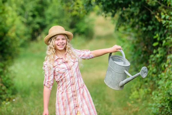 Optimize water use. Watering tools. Girl child hold watering can. Improve irrigation timing. Measure soil water content temperature and salinity. Spring gardening checklist. Watering plants in garden — Stock Photo, Image