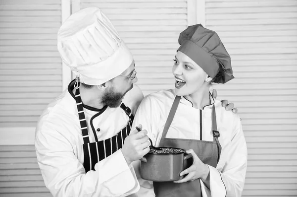 Good food with best friend. couple in love with perfect food. Family cooking in kitchen. man and woman chef in restaurant. Menu planning. culinary cuisine. secret ingredient by recipe. cook uniform