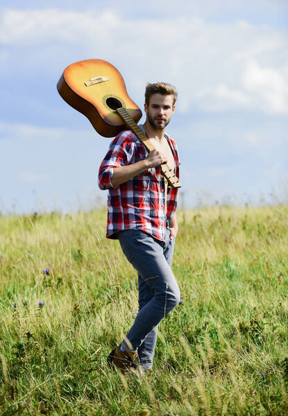 Musician looking for inspiration. Wanderlust concept. Inspiring nature. Guy with guitar contemplate nature. In search of muse. United with nature. Summer vacation. Dreamy wanderer. Peaceful mood