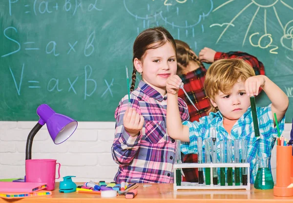 students doing science experiments with microscope in lab. back to school. school kids scientist studying science. children. Little kids learning chemistry in school laboratory. Concentrated on exam