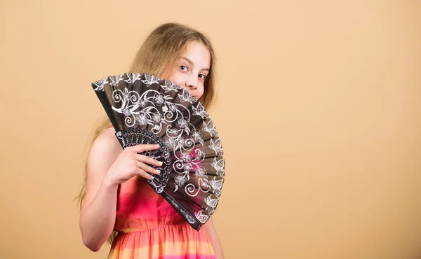 Folding fans. Acting school. Dances with fan. Girl fanning herself with fan. Air circulation. Art and culture. Handheld fan create airflow. Airflow from handfans increases evaporation. Cooling effect