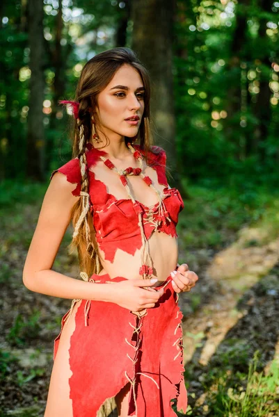 Forest fairy. Fashion and culture. Wilderness of virgin woods. Folklore character. Living wild life untouched nature. Wild attractive woman in forest. Sexy girl. Wild human. Female spirit mythology