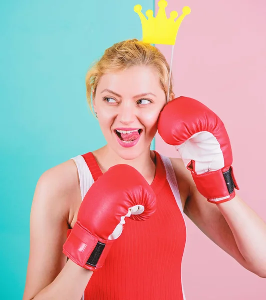 Its party time. Sportswoman with princess look. Funny woman with crown prop in boxing gloves. Cute boxer girl with party prop. Athletic woman in sports wear. Boxing is fun for her
