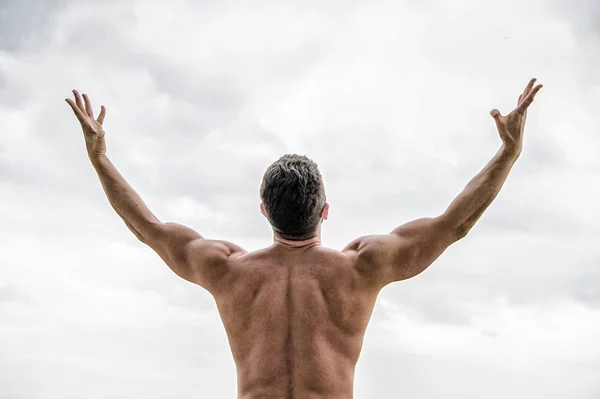 freedom feeling. Get ready to new day. muscular back man isolated on white. Sportsman raising hands. Man cheers success. Healthy lifestyle personal achievement goal and success