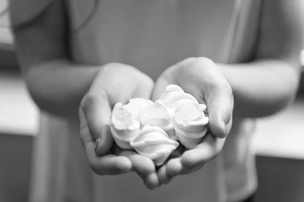 Challenge accepted. Kid girl eat sweets and treats. Calorie and diet. Incorrigible sweet tooth. Hungry kid. Girl holds sweet marshmallows in hand. Marshmallow challenge. Sweet dessert marshmallow — Stock Photo, Image