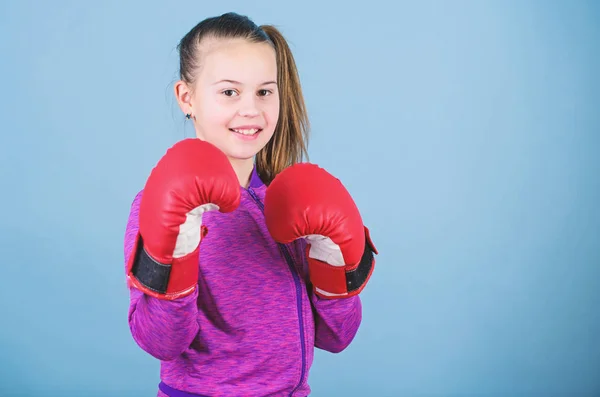 Rise of women boxers. Girl cute boxer on blue background. With great power comes great responsibility. Contrary to stereotype. Boxer child in boxing gloves. Female boxer change attitudes within sport