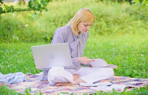 Business lady freelance work outdoors. Woman with laptop sit on rug grass meadow. Steps to start freelance business. Online or freelance career ideas concept. Guide starting freelance career