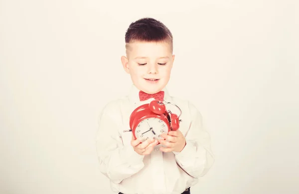 Time management. Morning. Party time. Businessman. Formal wear. tuxedo kid. Happy childhood. little boy with alarm clock. Time to relax. happy child with retro clock in bow tie. Quick chat at morning