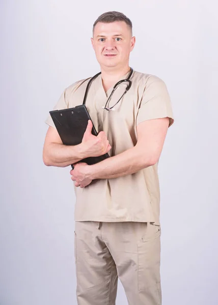 Man in medical uniform. Treatment prescription. nurse laboratory assistant. family doctor. medicine and health. confident doctor with stethoscope. pediatrician intern. Medical tool. medical folder — Stock Photo, Image