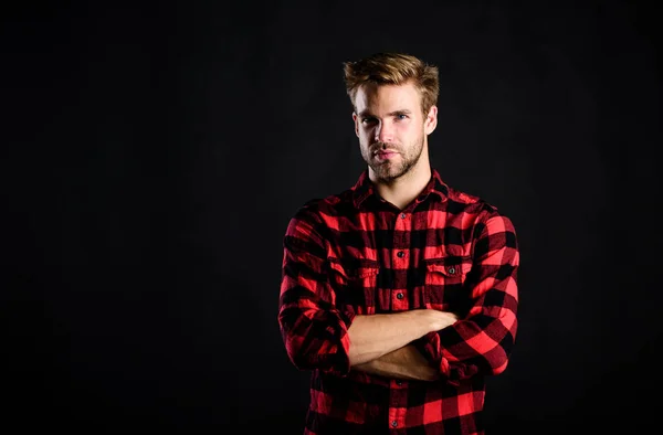 Standards of manliness or masculinity. Handsome well groomed man in checkered shirt. Manliness concept. Meaning of modern manliness. Male beauty, Barbershop and beauty salon. Hipster black background