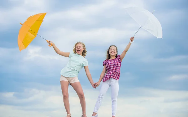 Time to rest. fall kid fashion. Feeling protected at this autumn day. happy small girls with umbrella. positive and bright mood. best friends. school time. autumn season. rainy weather forecast — Stock Photo, Image