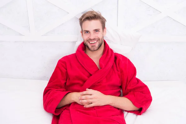 Bath is my luxury. Happy man wearing bath robe in morning. Sexy guy smiling after bath. Enjoying bath relaxation and wellness
