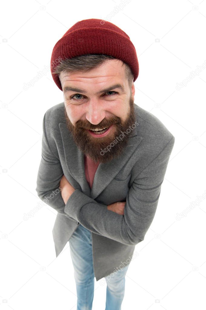Bearded and mustached. Bearded man looking straight into the camera. Bearded hipster wearing stylish hat on head. Brutal man with mustache and beard on unshaven bearded face