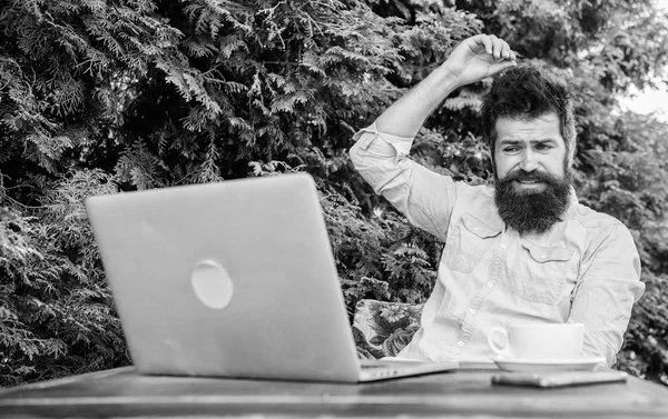 Write article for online magazine. Bearded hipster laptop surfing internet. Man looking for inspiration. Reporter journalist daily routine. Working online. Find topic write. Online mass media worker