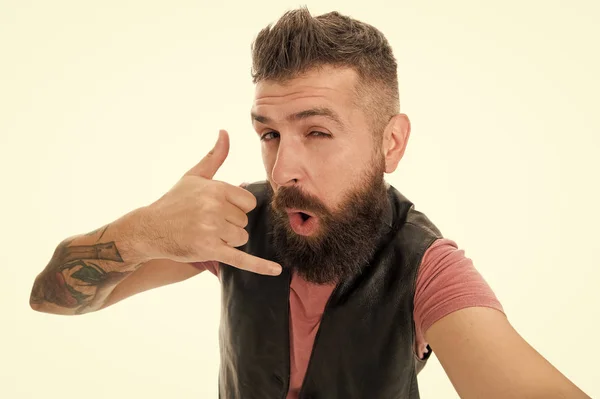 Call me later. Hipster with long beard symbol conversation. Mobile call. Mobile communication. Guy bearded hipster master of communications. Calling phone. Bearded man shows call me gesture