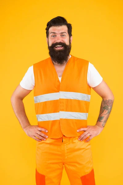 Man of any job. Man worker or workman smiling on yellow background. Happy construction worker or builder. Bearded man in work clothes. Professional man with long beard and mustache