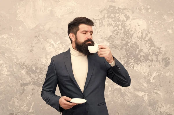 Best coffee served for him. Specialty coffee. Man handsome bearded businessman hold cup of coffee. Coffee break concept. Business people fashion style. Smart casual style clothes for office life