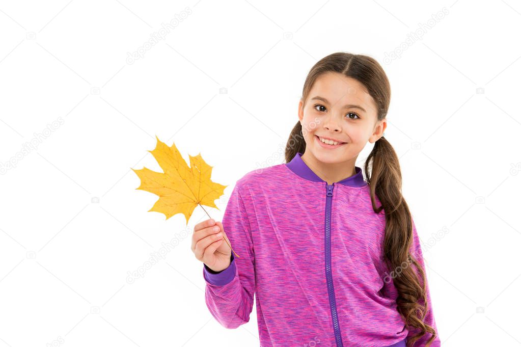 Autumn is second spring when every leaf is flower. Kid girl hold fallen maple leaf. Happy small child play with autumn leaf. Kids fashion. Kid isolated on white show yellow leaf. Black friday concept