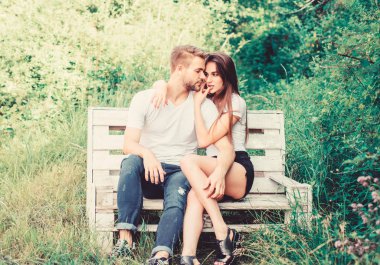 Enjoying nice weekend together. valentines day. summer camping in forest. family weekend. romantic date. man with woman in park. couple relax outdoor on bench. Secret place. couple in love. Happiness clipart